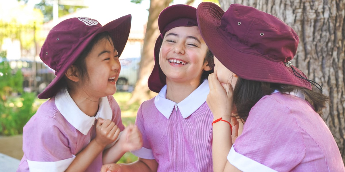 three female mortlake students laughing together